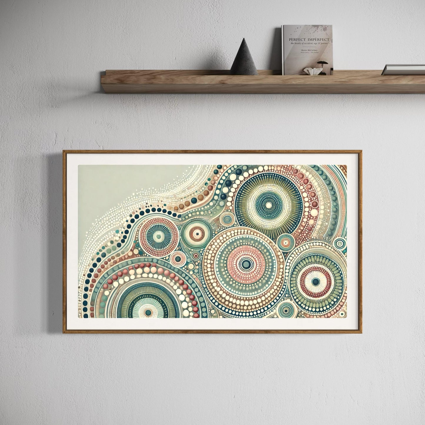 Yirrarn Aboriginal dot painting printable in pastel earth tones, framed in oak wood above minimalist shelf with books and modern decor
