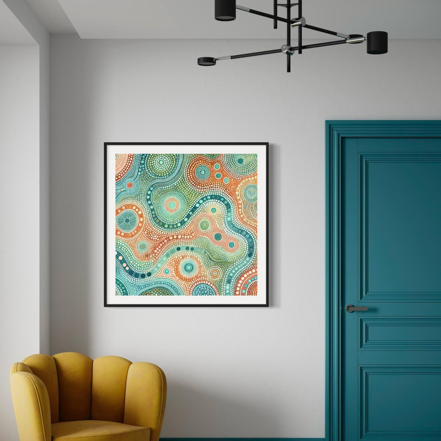 Ngapa Kuruwali Aboriginal dot painting printable framed on white wall with teal door, mustard chair, and modern black ceiling light