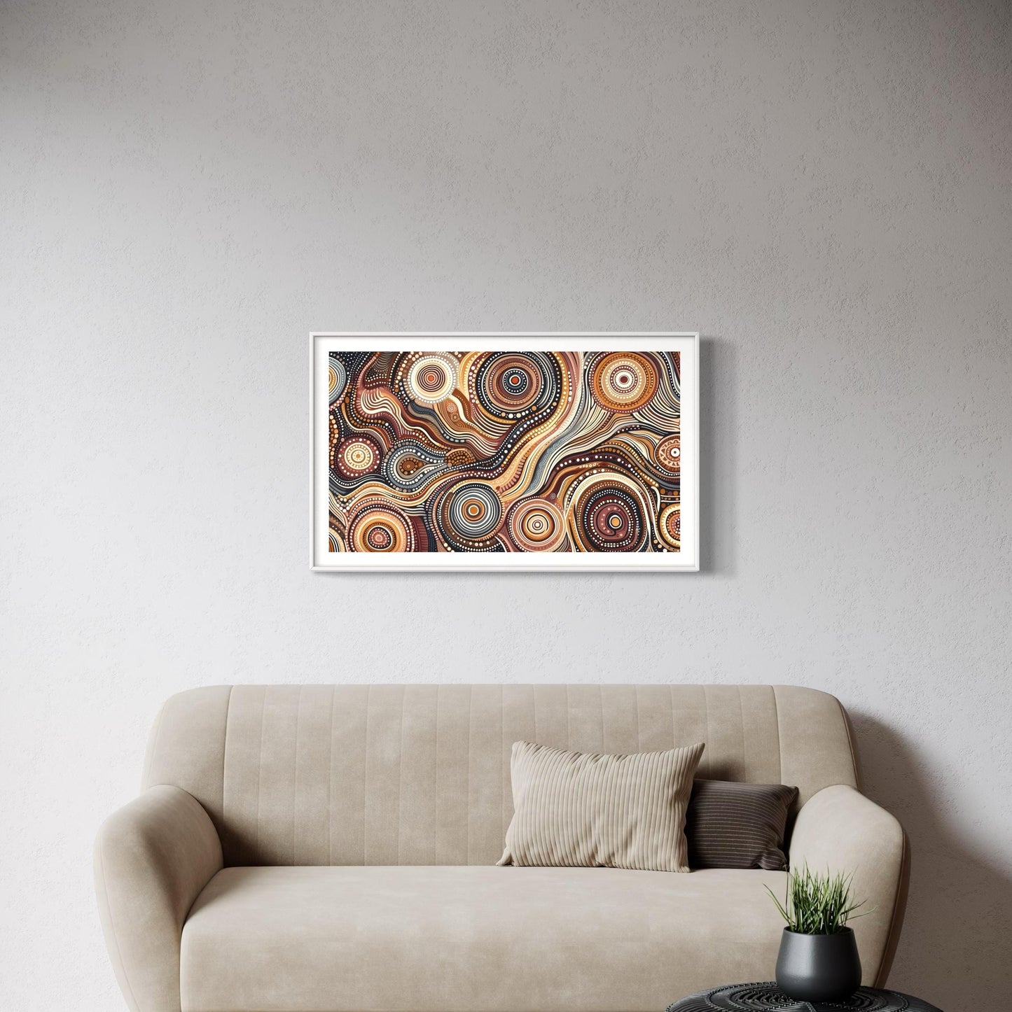 Walu Wirin Aboriginal dot painting horizontal print framed above a modern beige sofa with neutral cushions, set against a light grey wall with a black woven coffee table.