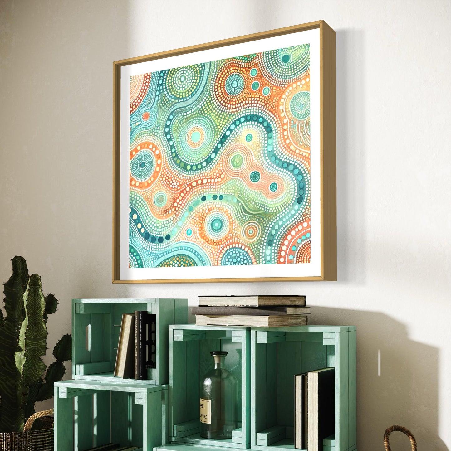 Ngapa Kuruwali Aboriginal dot painting printable framed in light wood, displayed above green crate shelves with books and rustic decor