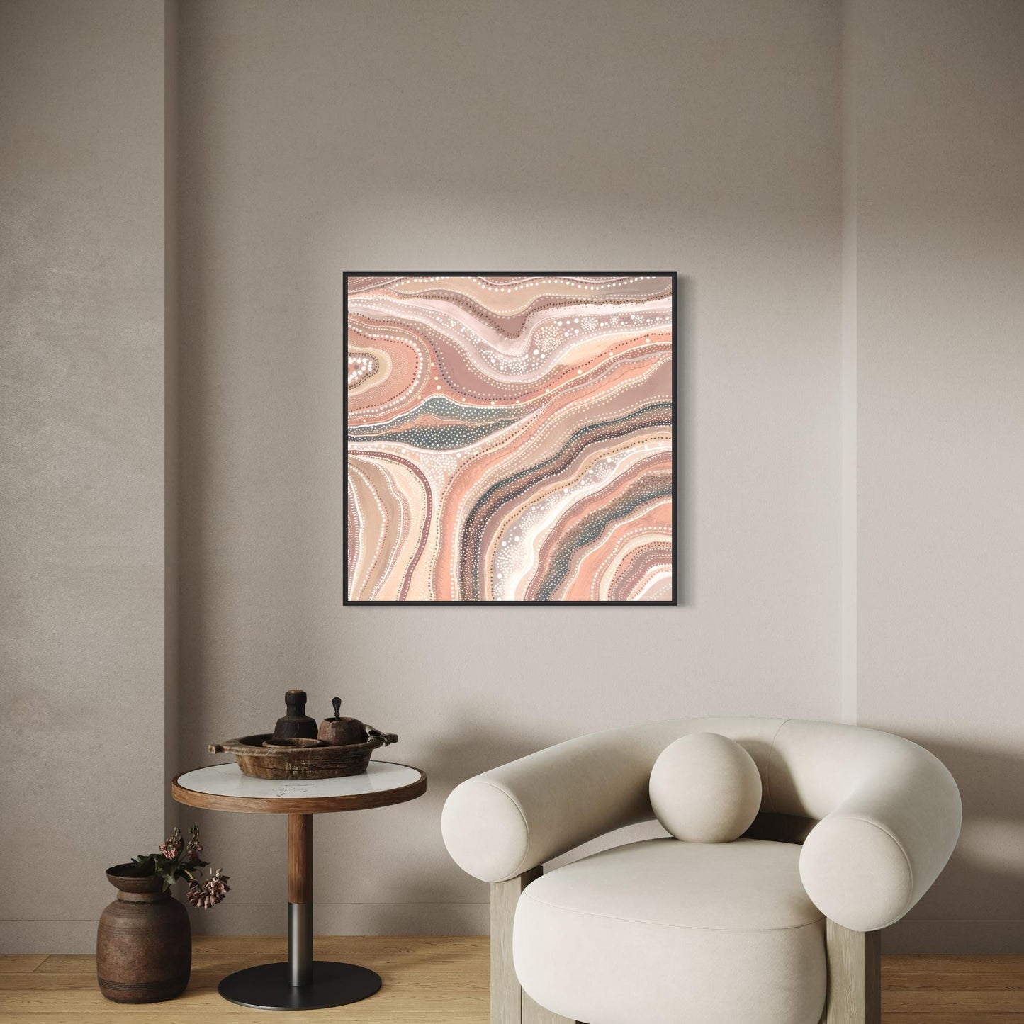Marrinpa Aboriginal dot painting printable in earthy neutrals framed on beige wall above round side table with pottery and cream armchair decor