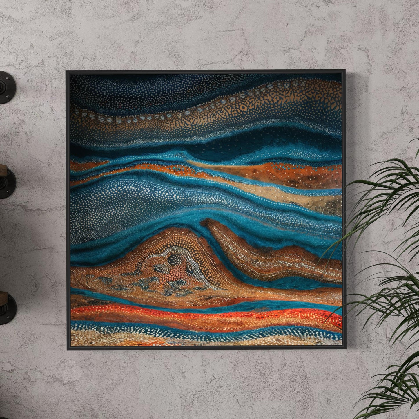 Karli Flow Aboriginal dot painting in a modern black frame, displayed against a textured grey wall with floating wooden shelves and a leafy green plant adding a natural touch.